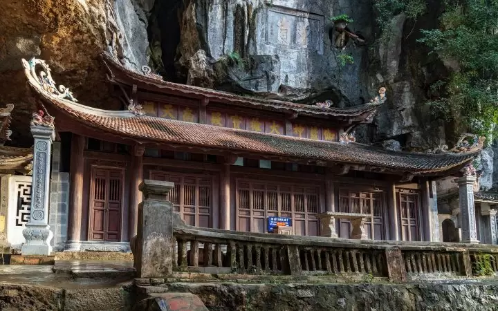 Unique Middle Pagoda with a half inside the cave and a half outside the mountain