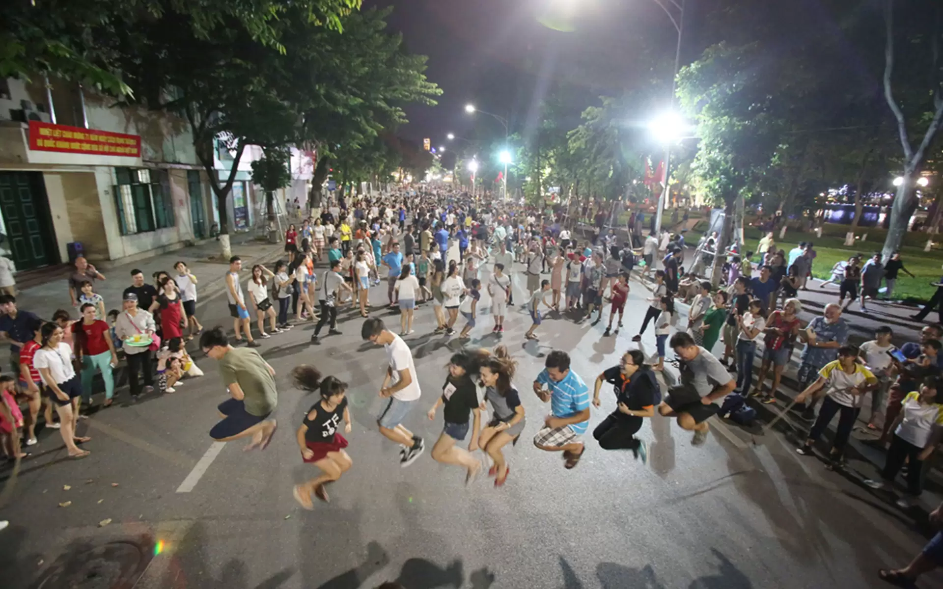 Trying Vietnamese traditional game in Hanoi walking street